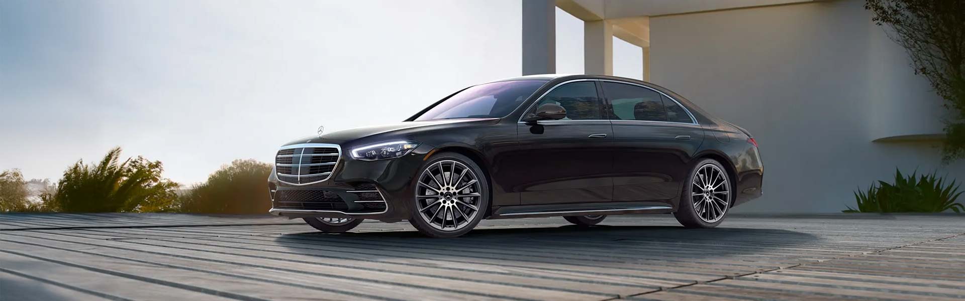 a black 2026 Mercedes-Benz S-Class parked out side of a building