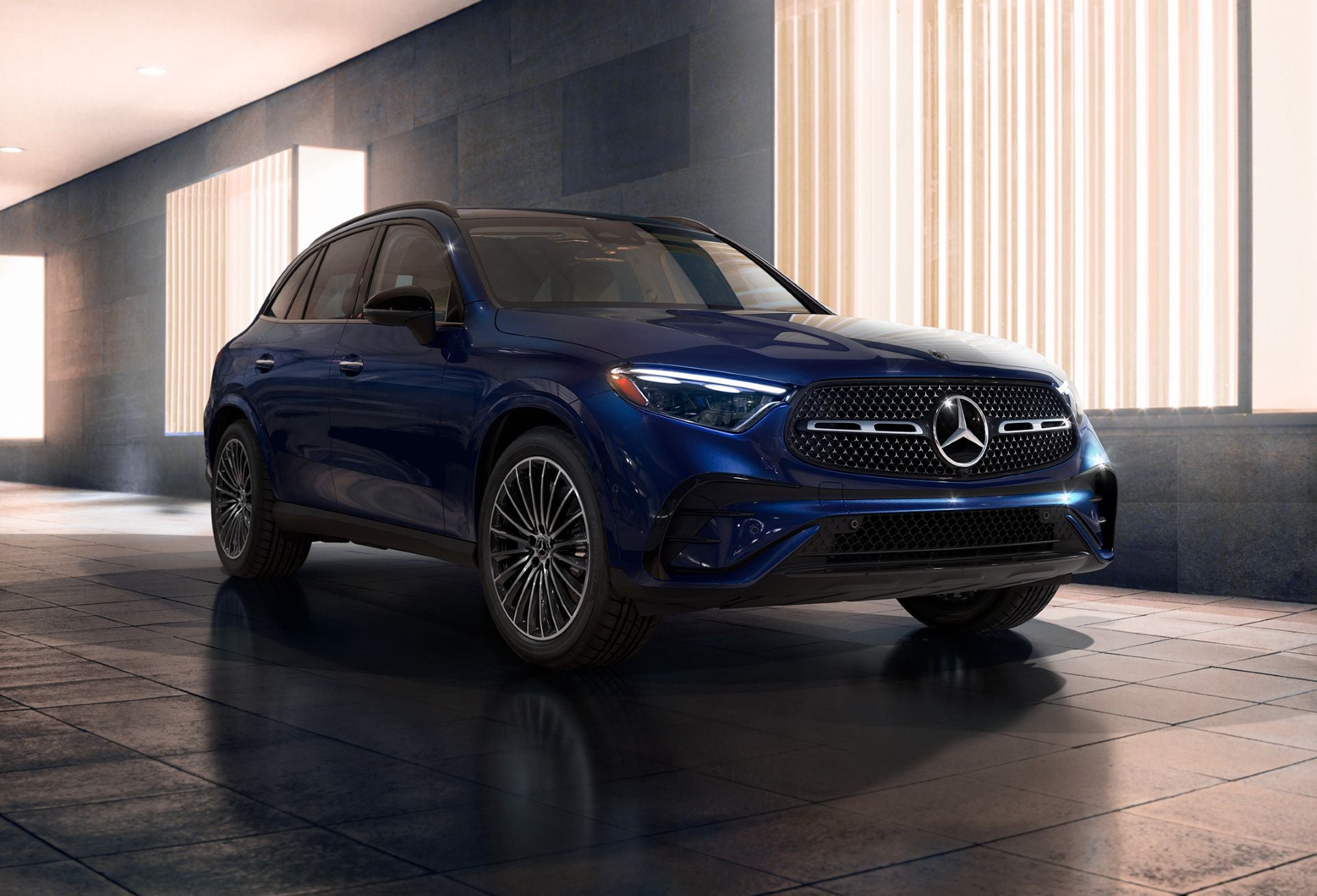 Mercedes-Benz GLC midsize luxury SUV driving through a city neighborhood