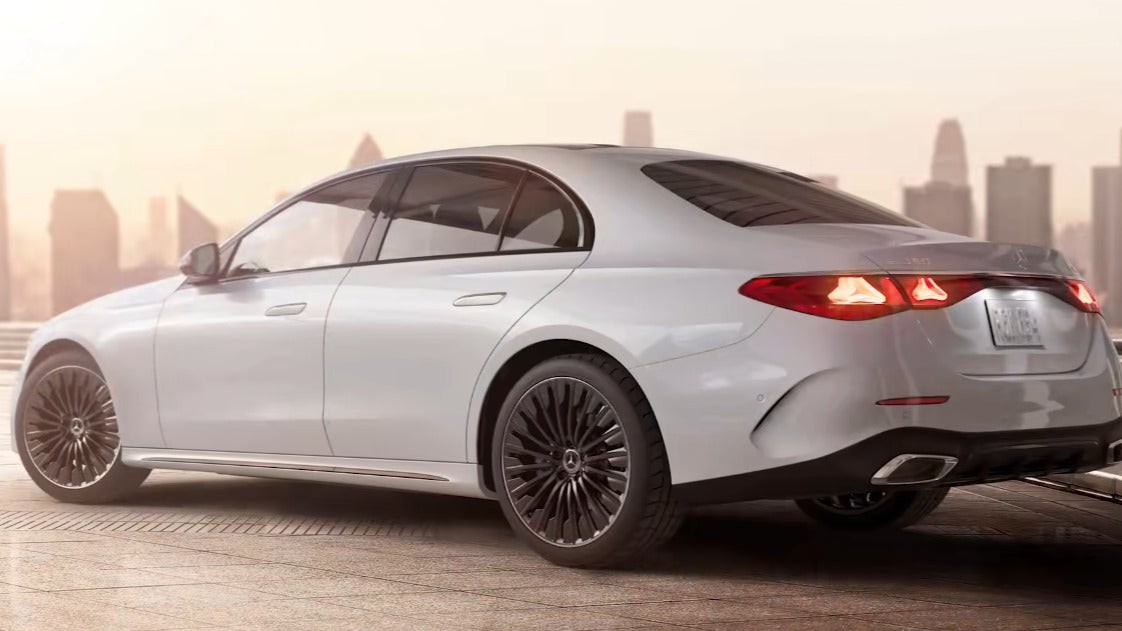 2026 Mercedes-Benz E-Class an exterior view of the vehicle parked out side the city sky line