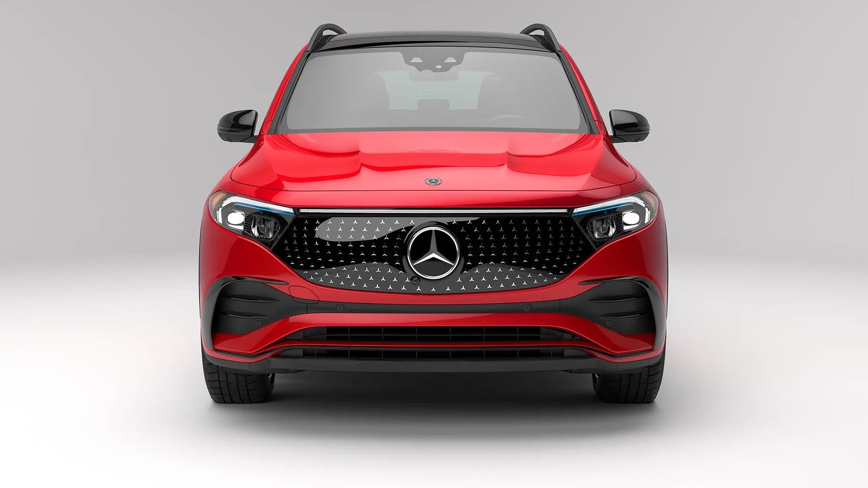 a red 2026 Mercedes-Benz EQB parked in show room floor