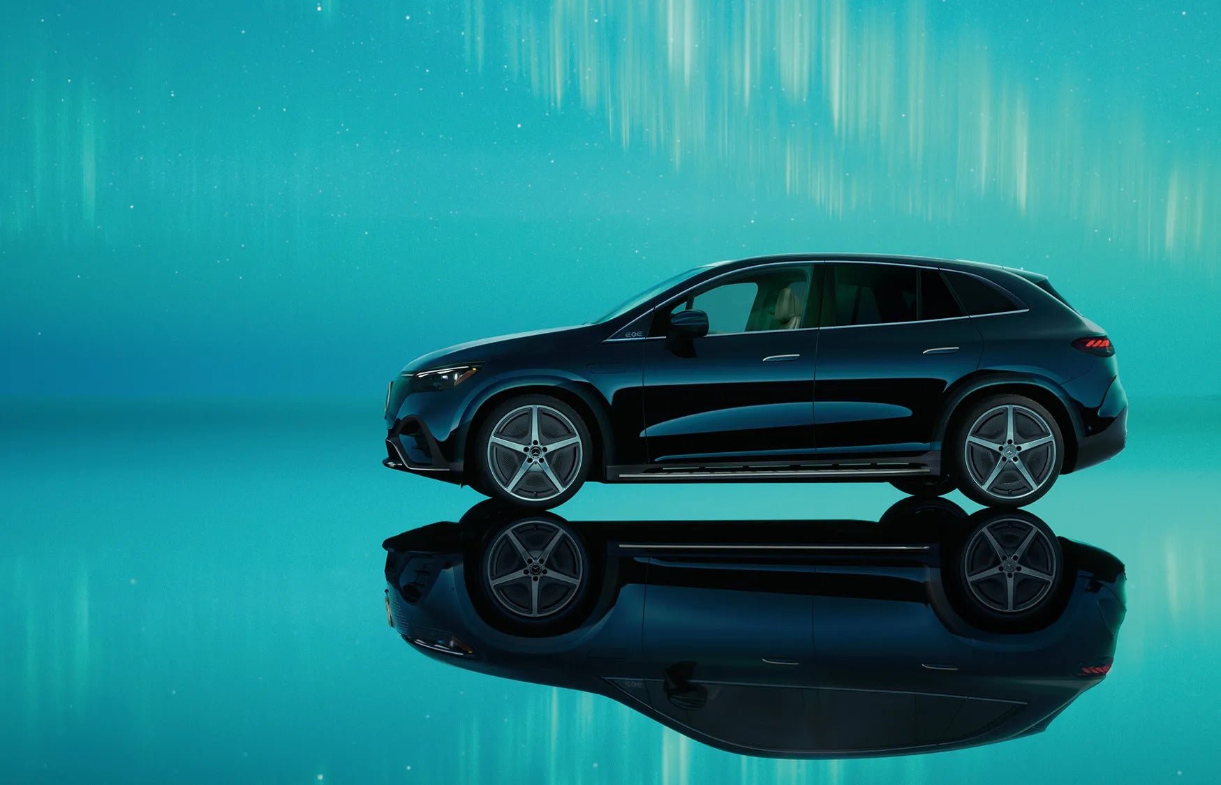 A navy 2026 Mercedes-Benz EQE parked in a show room